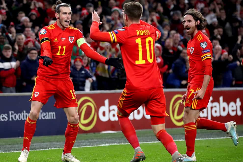 Wales’ three main players of the past decade – Gareth Bale (left), Aaron Ramsey (centre) and Joe Allen (right) – are hoping to make a World Cup at the end of their careers (Nick Potts/PA)