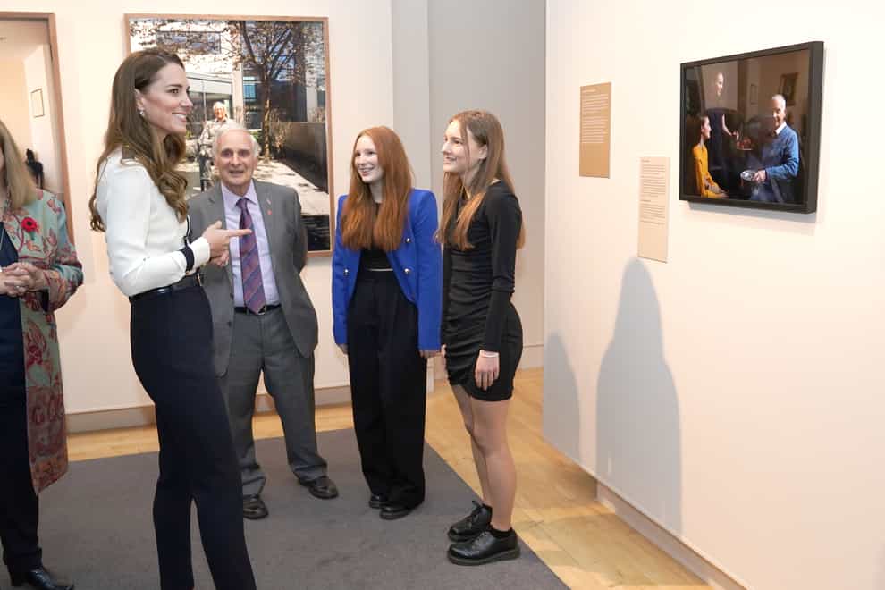 The Duchess of Cambridge (left) views the exhibition Generations: Portraits of Holocaust Survivors, which includes the two portraits she took last year to mark 75 years since the end of the Holocaust, during a visit to the Imperial War Museum (IWM) in London to officially open two new galleries, the Second World War Gallery and the Holocaust Gallery. Picture date: Wednesday November 10, 2021.