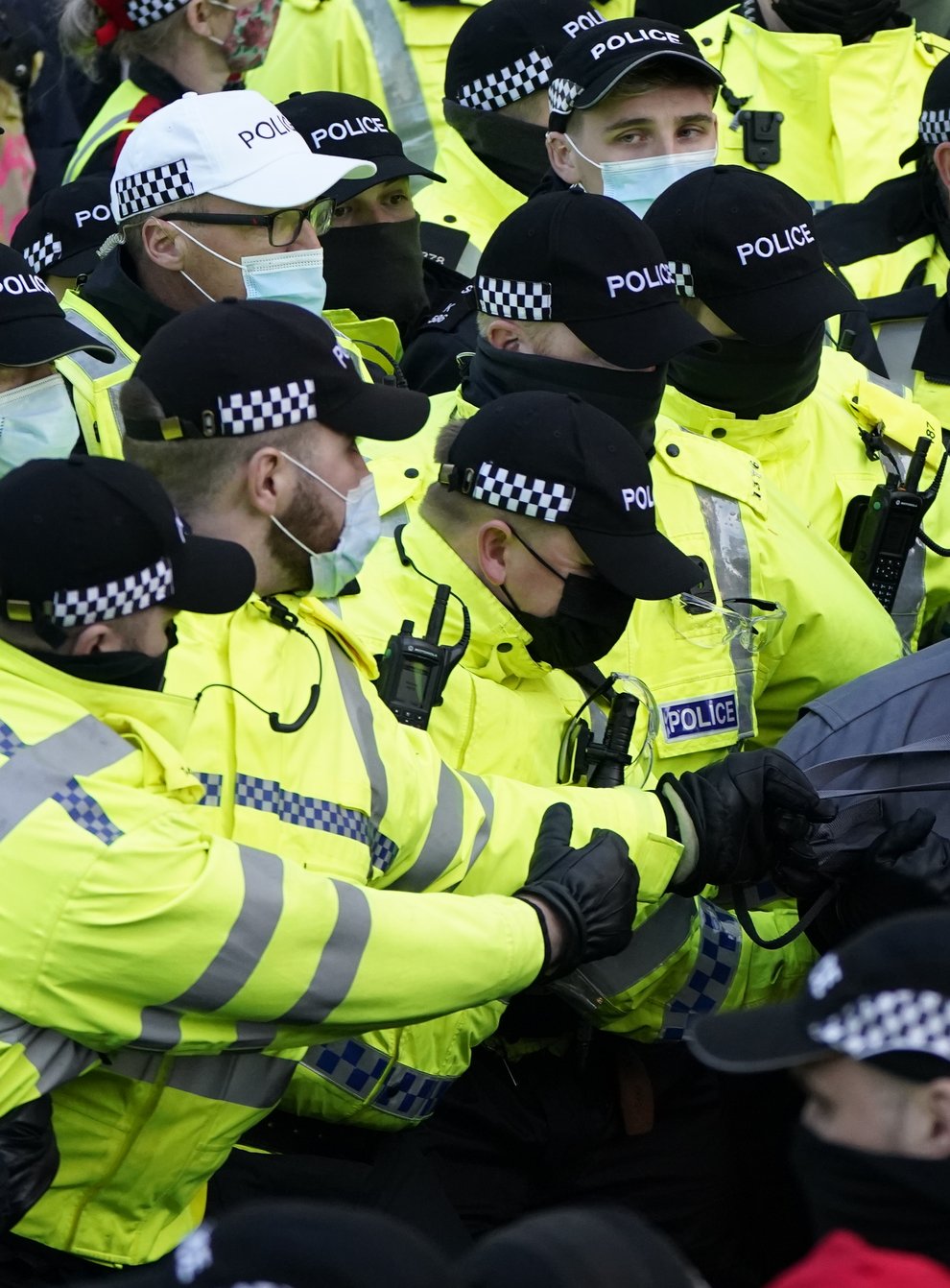 Police tug at a bag as they halt part of a march by protesters taking part in a rally organised by the Cop26 Coalition in Glasgow demanding global climate justice. (Danny Lawson/PA)