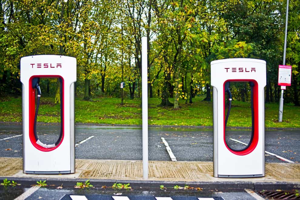 Tesla charging points (Alamy/PA)