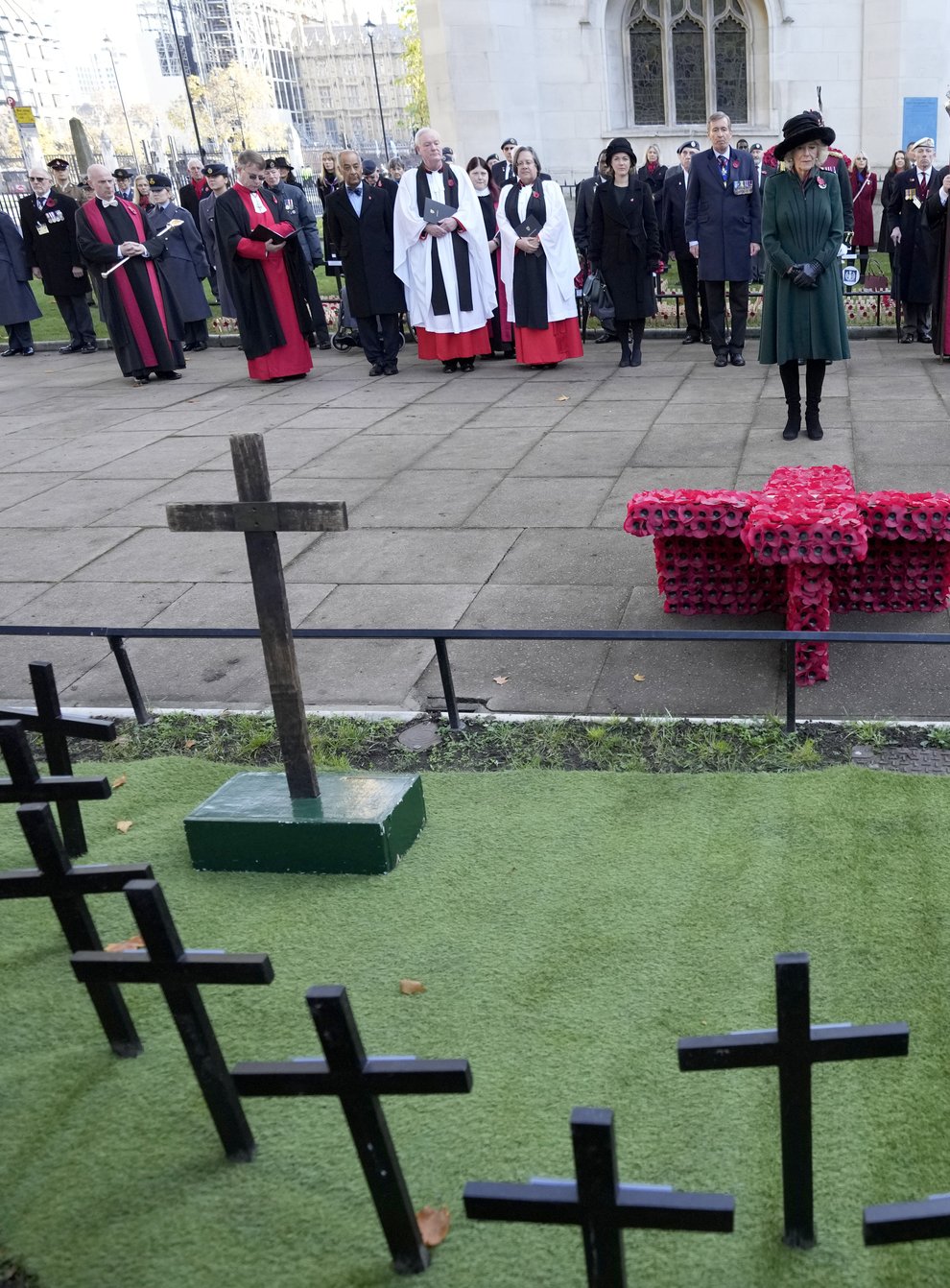 The Duchess of Cornwall observes a two-minute silence to remember the war dead on Armistice Day during a visit to the 93rd Field of Remembrance at Westminster Abbey (Frank Augstein/PA)