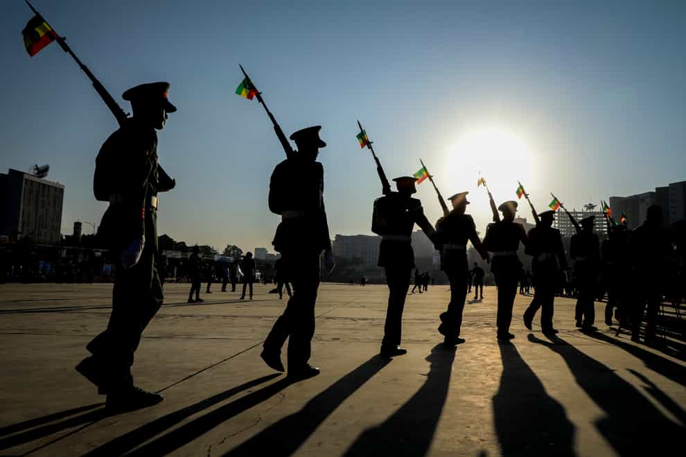 Ethiopian military parade with national flags attached to their rifles in Addis Ababa (AP)