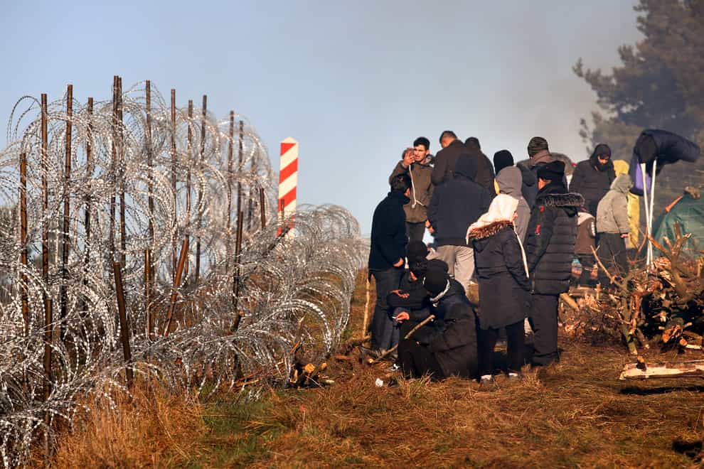 Migrants gather at the Belarus/Poland border near Grodno (Leonid Shcheglov/BelTA via AP)