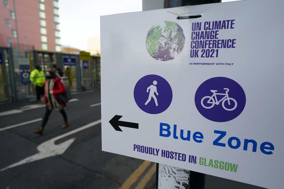 Delegates arrive at the entrance to the Cop26 summit in Glasgow (Andrew Milligan/PA)