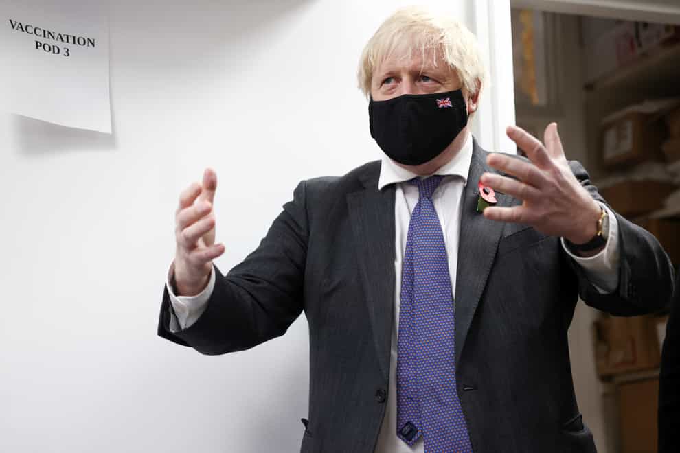 Prime Minister Boris Johnson visits a Covid-19 vaccination centre at a pharmacy in Sidcup (Henry Nicholls/PA)