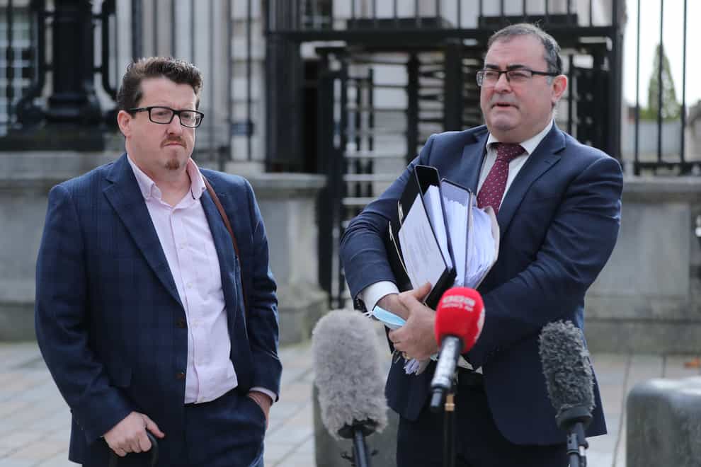 Belfast businessman Sean Napier (left) and his his solicitor Paul Farrell leave Belfast High Court during a previous hearing (Niall Carson/PA)