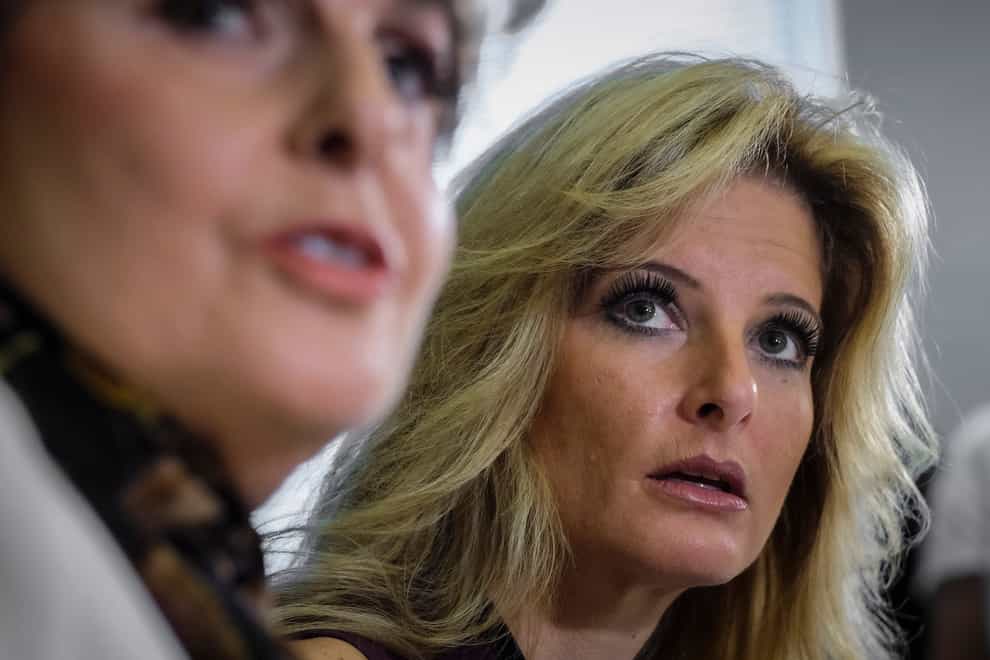 Summer Zervos, right, a former contestant on The Apprentice, has dropped her defamation lawsuit against former President Donald Trump. (Ringo HW Chiu/AP)