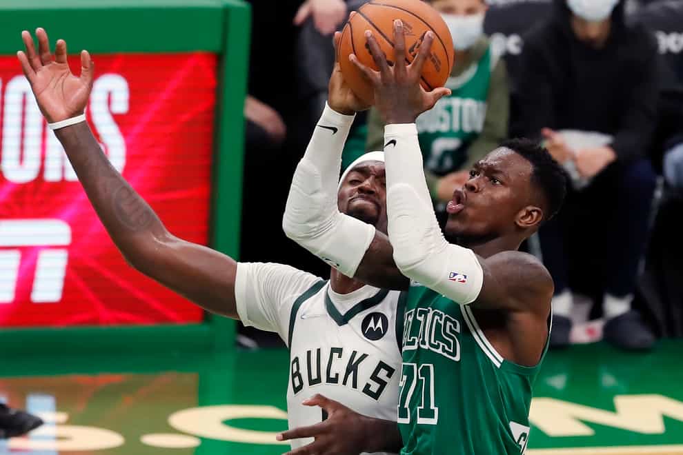 Boston’s Dennis Schroder (71) shoots against Milwaukee Bucks’ Bobby Portis in overtime in the Celtics’ win on Friday night (Michael Dwyer/AP)
