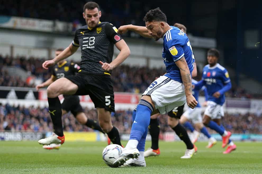 Ipswich’s Macauley Bonne, right, has a shot on goal against Oxford (Nigel French/PA)
