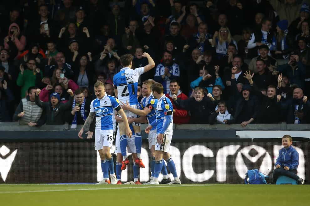 Bristol Rovers’ Antony Evans (top) celebrates his winning goal (Steven Paston/PA).
