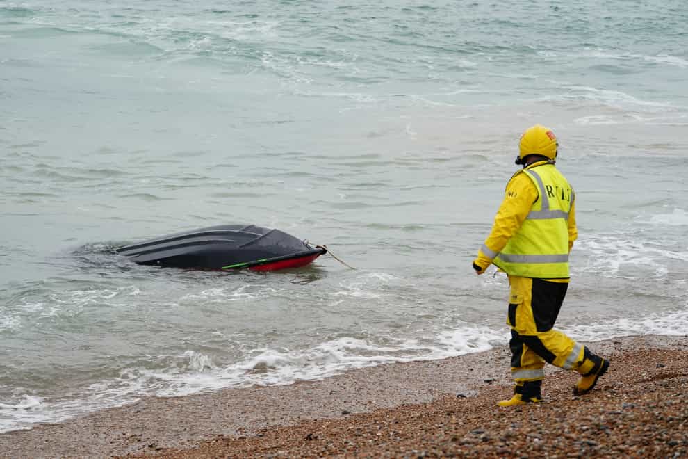 A je-t ski thought to have been used in a migrant crossing is brought in to Dungeness, Kent, by the RNLI (Gareth Fuller/PA)