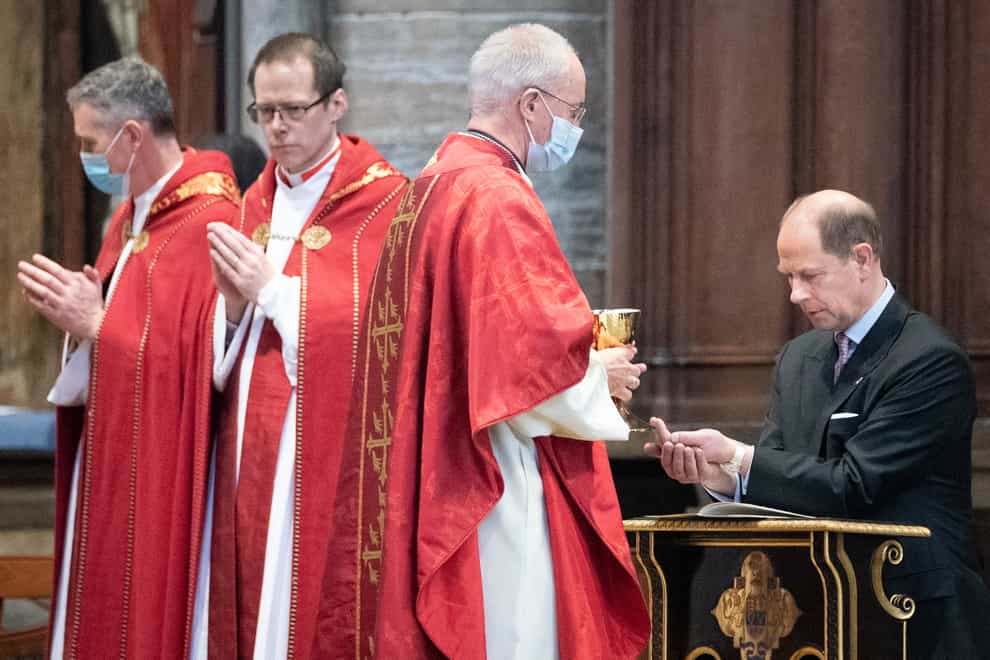 The Earl of Wessex (right) receives holy communion (Stefan Rousseau/PA)