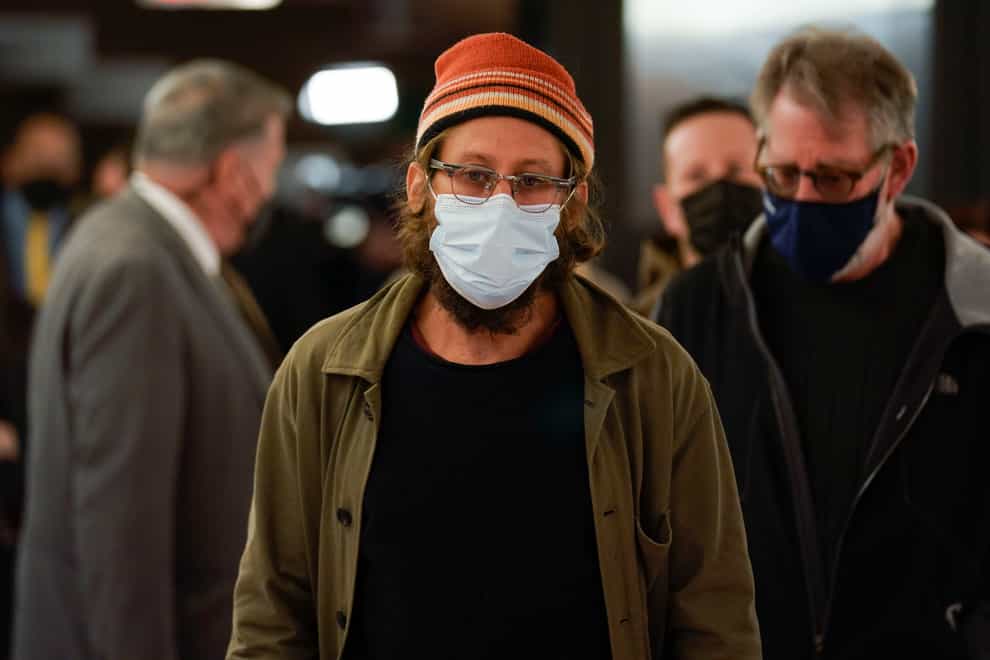 Danny Fenster arrives for a news conference after he landed at John F. Kennedy Airport in New York, Tuesday, Nov. 16, 2021. The American journalist, who spent nearly six months in jail in military-ruled Myanmar, arrived in the United States. Fenster was sentenced last week to 11 years of hard labor. He was handed over Monday to former U.S. diplomat Bill Richardson, who helped negotiate the release. (AP Photo/Seth Wenig)