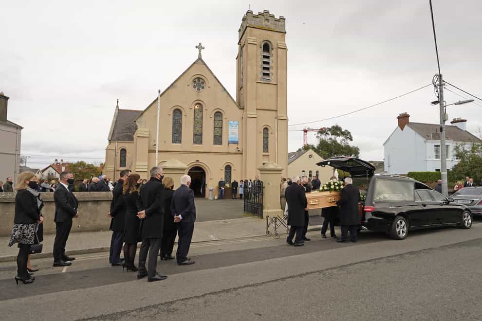 The coffin of Sean FitzPatrick, the former chief executive and chairman of Anglo Irish Bank, is carried into Holy Rosary Church, Greystones, Ireland, ahead of his funeral (Niall Carson/PA)