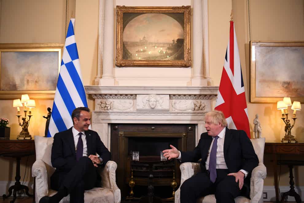 Prime Minister Boris Johnson speaks with Greece’s Prime Minister Kyriakos Mitsotakis (Daniel Leal/PA)