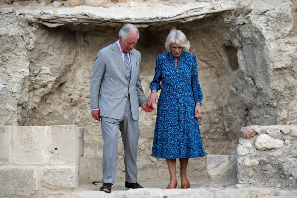 The Prince of Wales and Duchess of Cornwall during a visit to Elijah’s Hill and the Baptismal Site of Jesus Christ (PA)