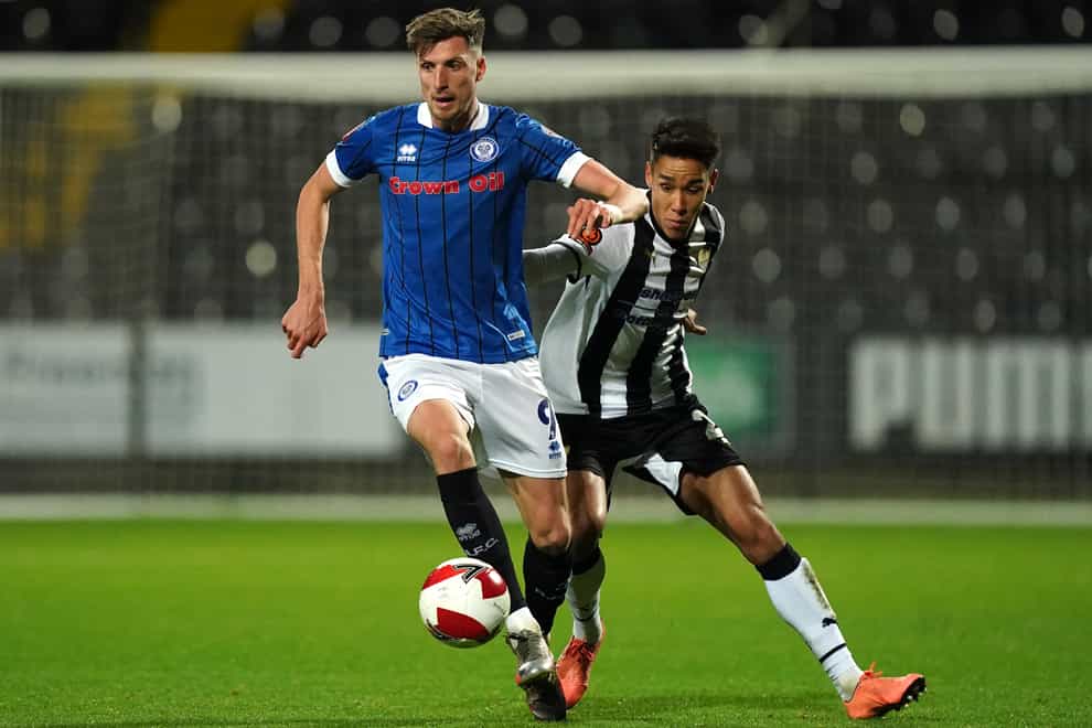 Rochdale’s Jake Beesley and Notts County’s Adam Chicksen battle for the ball (Mike Egerton/PA)