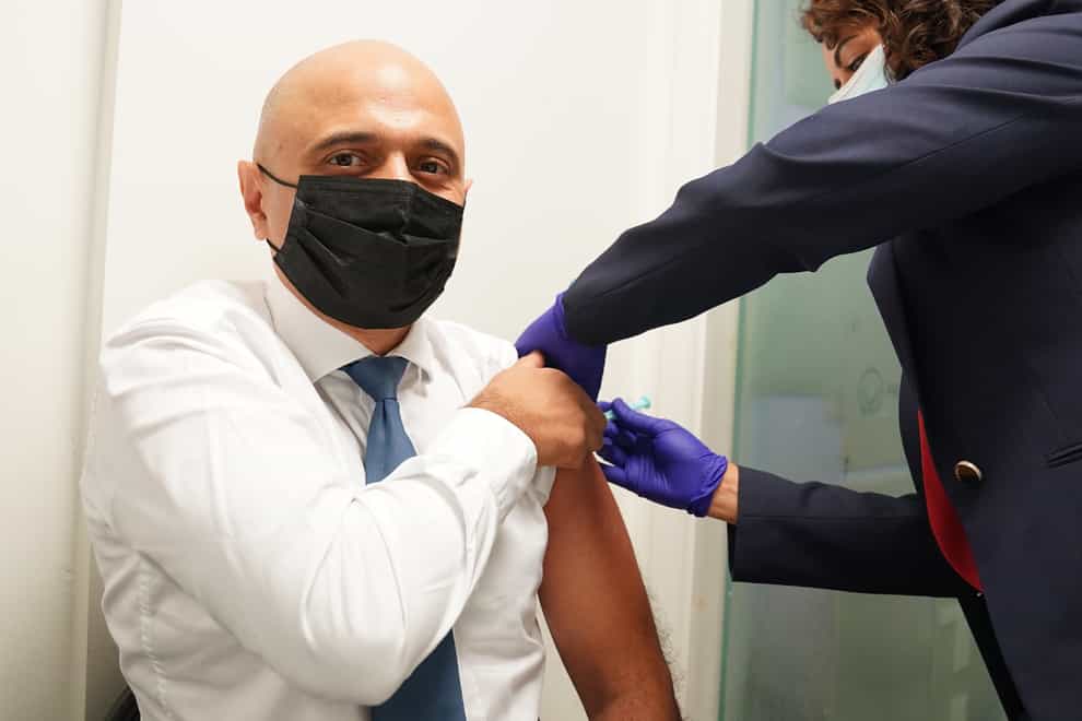 Health Secretary Sajid Javid receives his Covid-19 booster jab from Nikki Kanani, Medical director primary care NHS England, at a pharmacy in central London (PA)