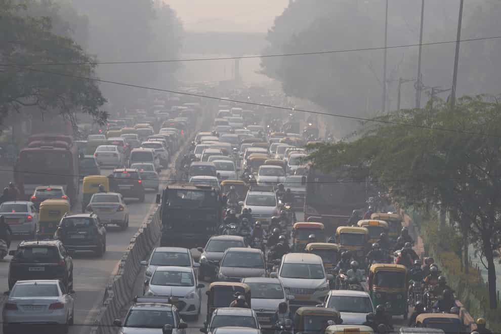 Commuters drive in morning haze and toxic smog in New Delhi, India (Manish Swarup/AP)