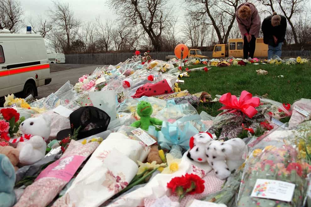 Teddy bears, floral tributes and letters continue to pile up around the area of the railway embankment in Walton where two year old James Bulger was murdered (John Giles/PA)