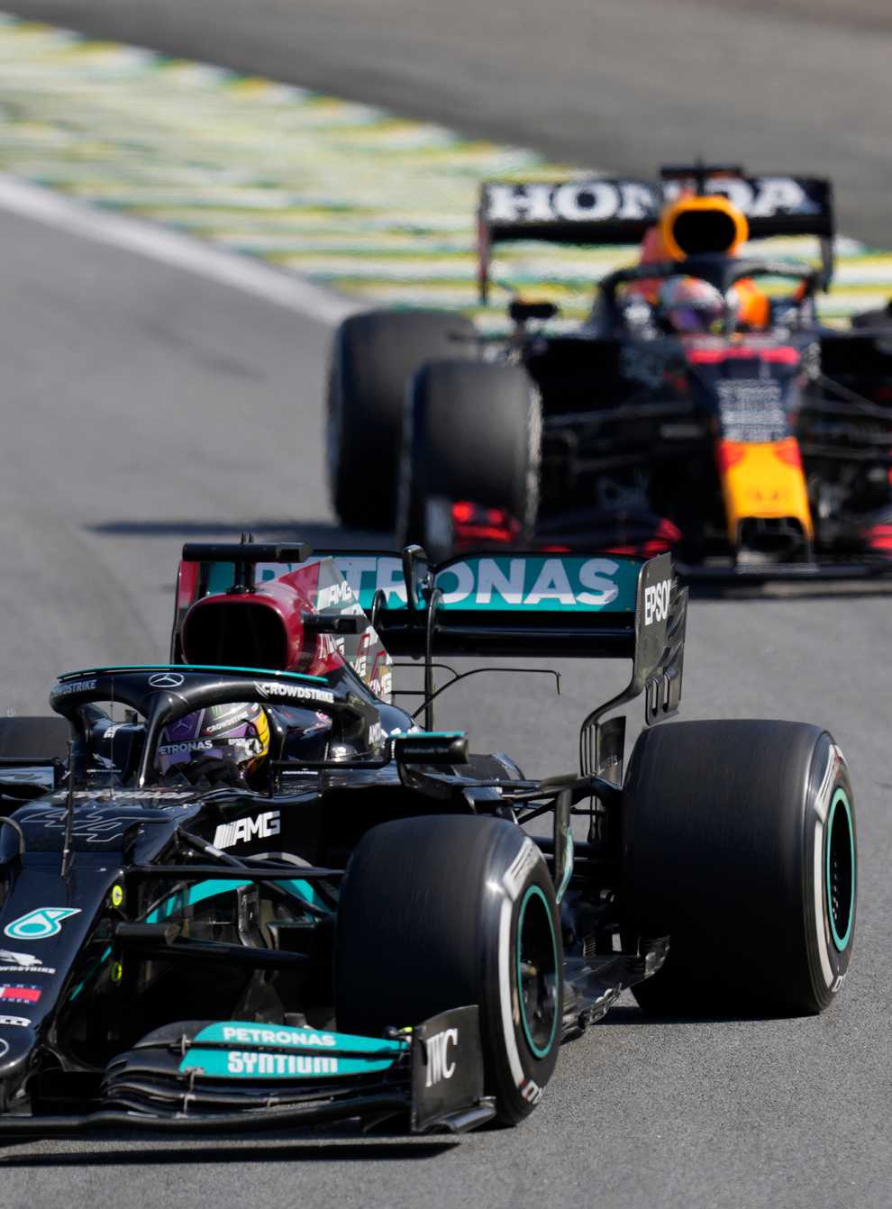 Lewis Hamilton, front, was able to pass Max Verstappen later in the race after they clashed at Interlagos (Andre Penner/AP)