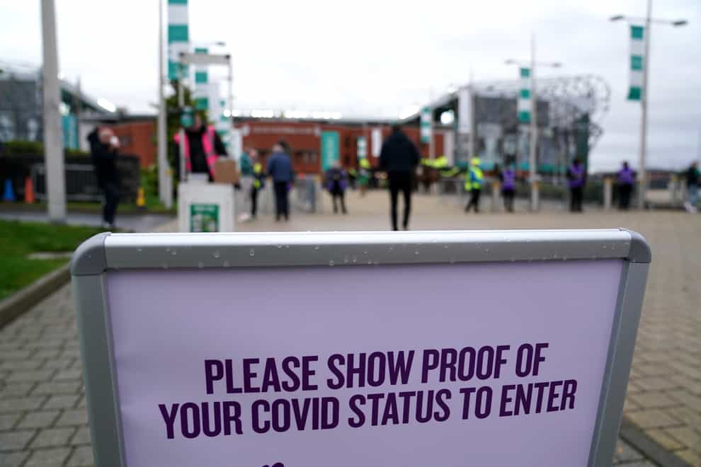 Signage informing spectators they need to show their vaccine passports in Scotland (PA)