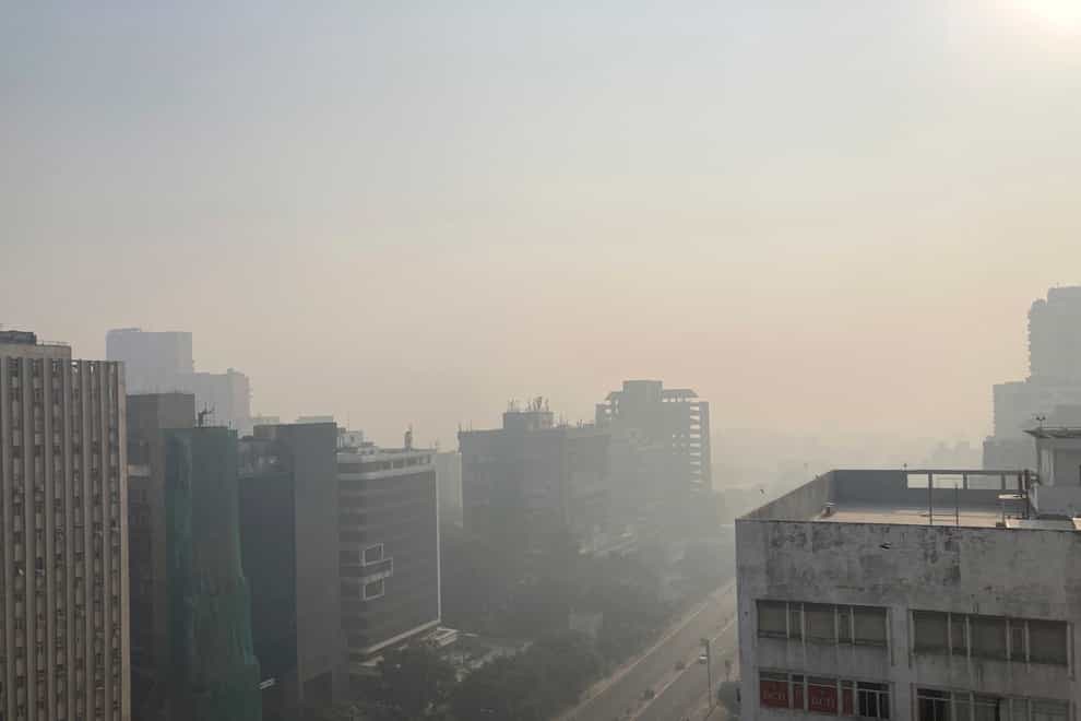 The New Delhi skyline is seen enveloped in smog (Shonal Ganguly/AP)