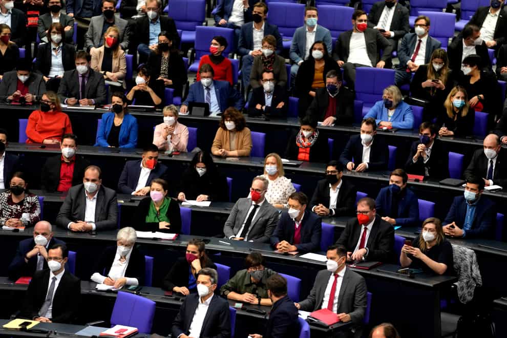 Lawmakers wear face mask as they attend a Bundestag session (Markus Schreiber/AP)