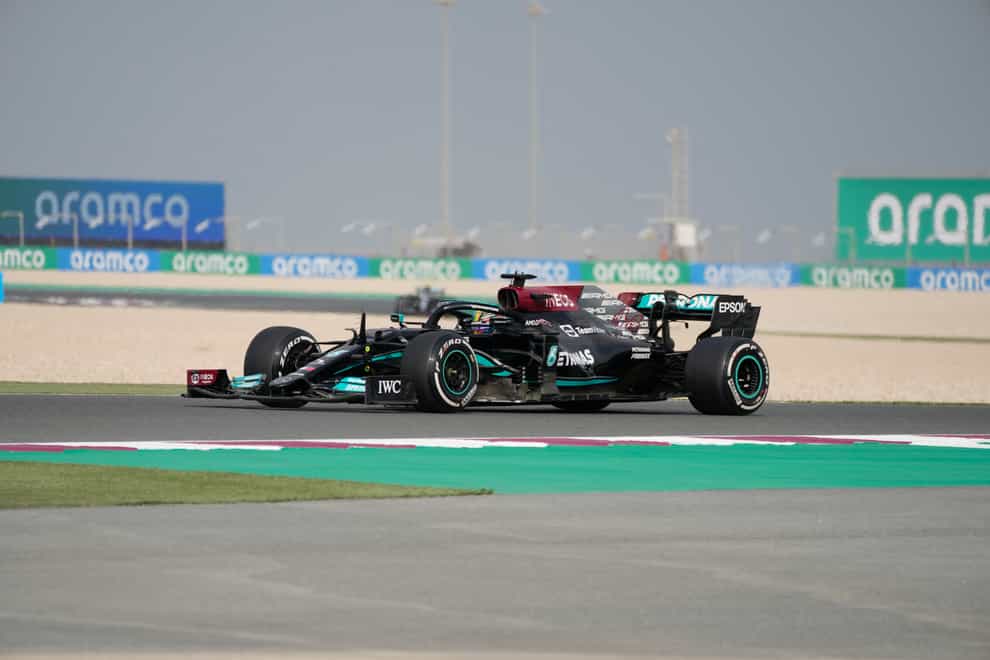 Lewis Hamilton is wearing a rainbow helmet in Qatar (Darko Bandic/AP)