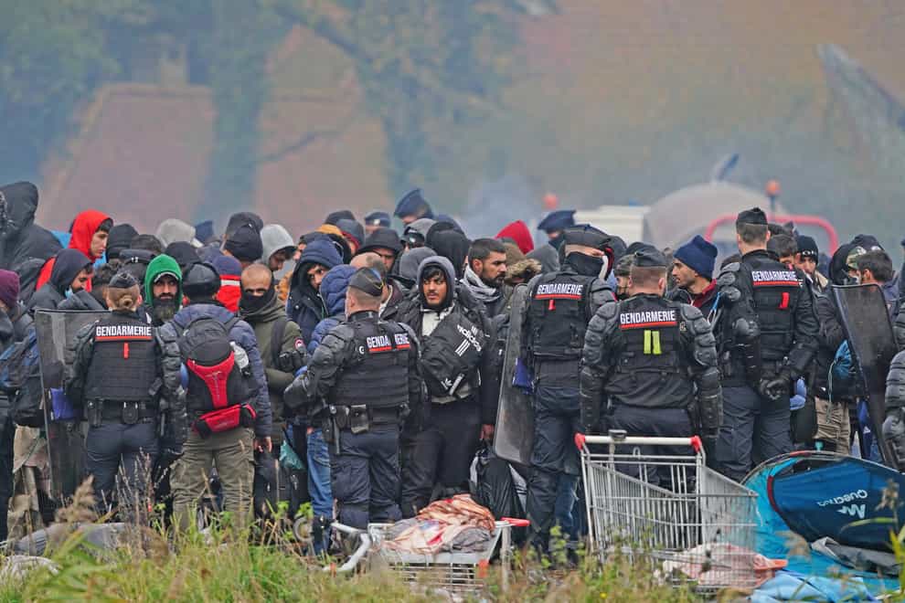 Migrants at a makeshift camp on the site of a former industrial complex in Grande-Synthe, east of Dunkirk. (Gareth Fuller/PA)