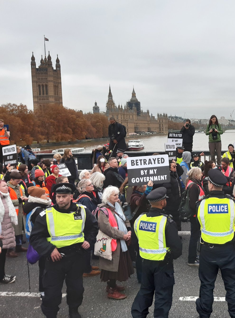 Supporters of the nine jailed Insulate Britain climate activists take part in a demonstration on Lambeth Bridge (Helen William/PA)