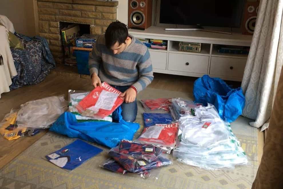 Paul Watson with donated football shirts (Kitmas)