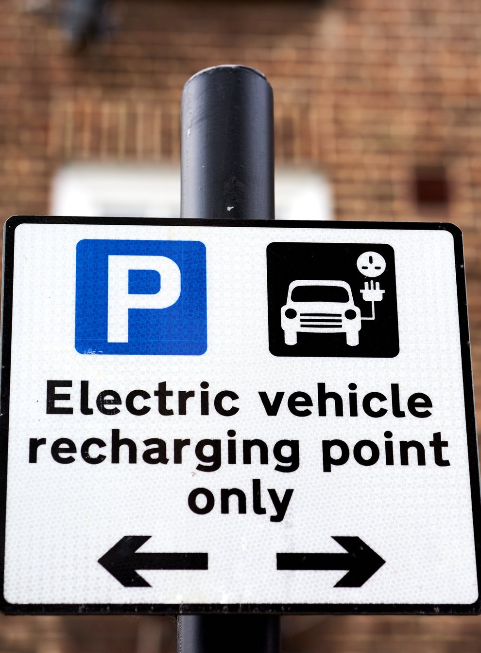 File photo dated 05/03/21 of an electric vehicle signage. (John Walton/PA)