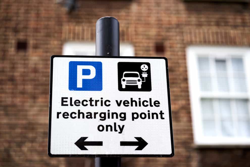 File photo dated 05/03/21 of an electric vehicle signage. (John Walton/PA)