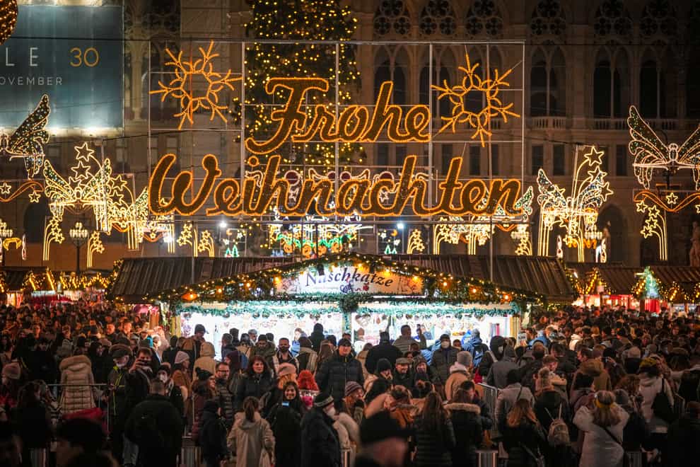 People crowd a Christmas market in Vienna before Austria entered a nationwide lockdown on Monday (Vadim Ghirda/AP/PA)