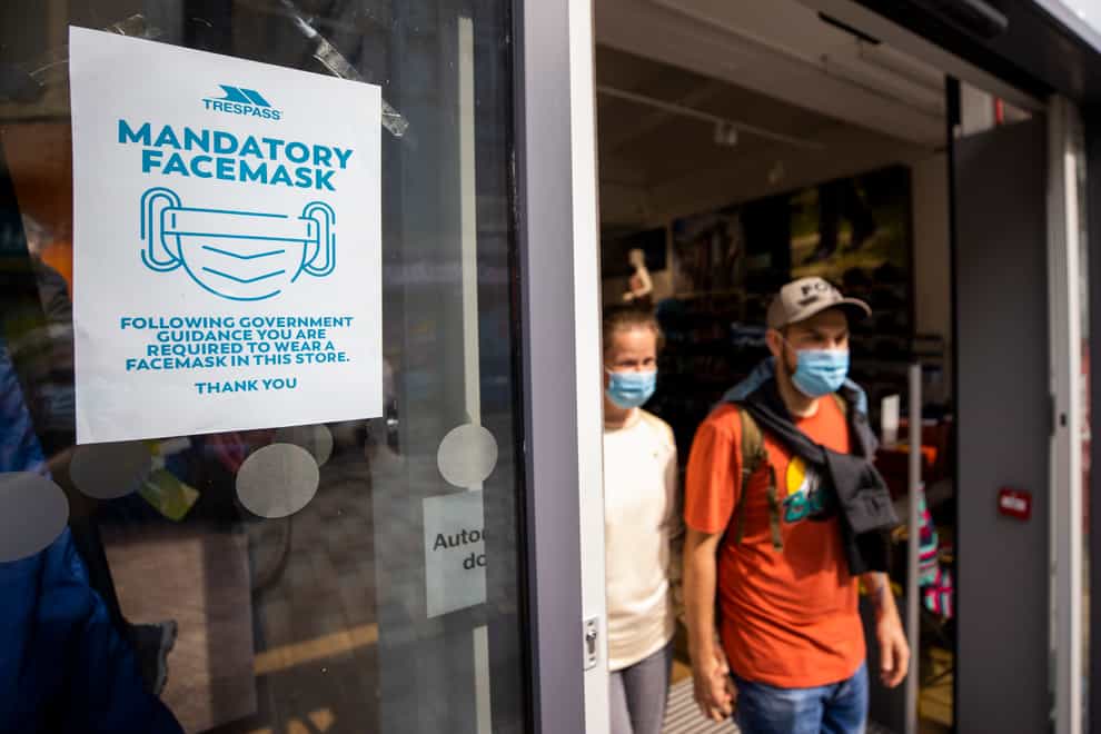 A sign in Belfast says the wearing of face masks is mandatory (Liam McBurney/PA)