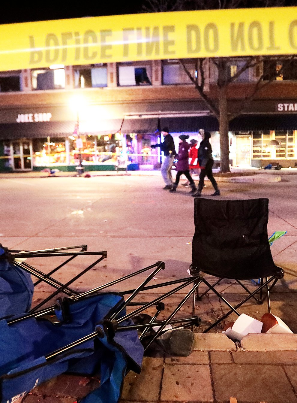 Toppled chairs after an SUV drove into a Christmas parade in Waukesha (John Hart/Wisconsin State Journal via AP)