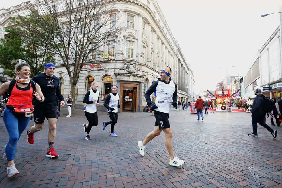 Kevin Sinfield crosses Long Row in Nottingham city centre during the Extra Mile Challenge (Zac Goodwin/PA)