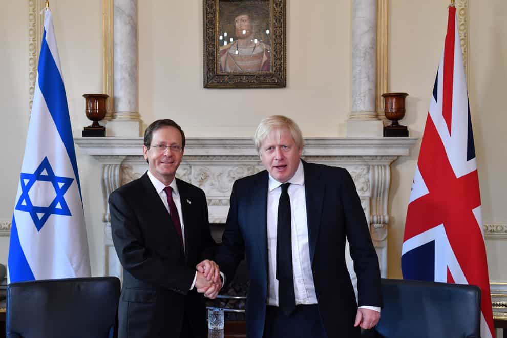 Prime Minister Boris Johnson (right) shakes hands with the President of Israel Isaac Herzog (Justin Tallis/PA)