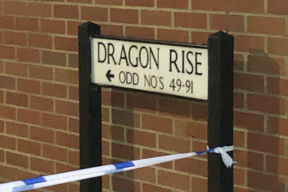 Police tape around the street sign for Dragon Rise in Norton Fitzwarren (Tess De La Mare/PA)