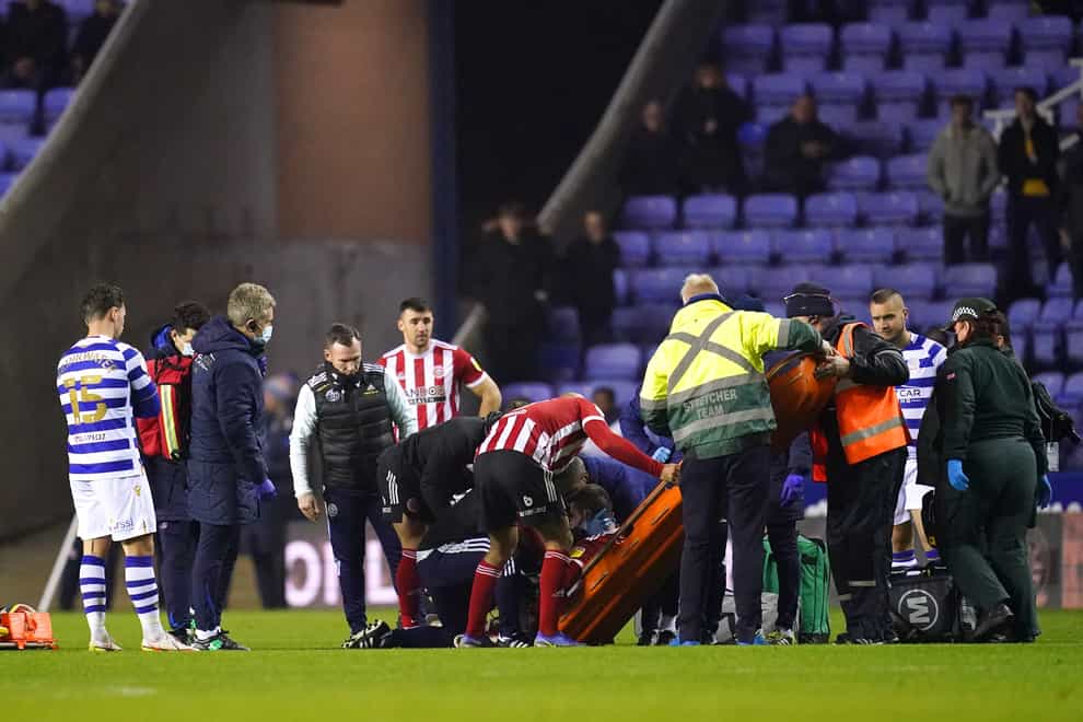 Sheffield United’s John Fleck is placed on a stretcher during the match at Reading (John Walton/PA)