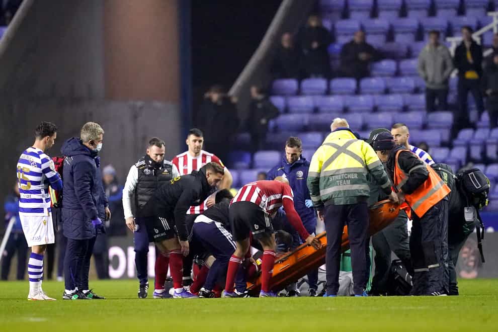 Sheffield United’s John Fleck is placed on a stretcher during the game at Reading (John Walton/PA)