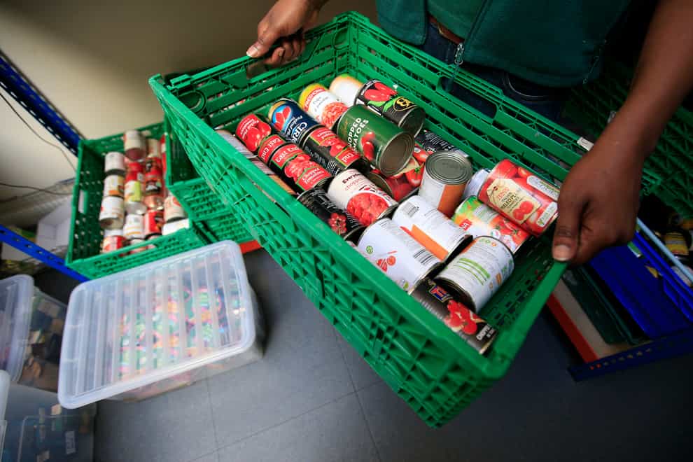 The Trussell Trust handed out 935,749 parcels over the six months to October 2021, more than a third of which went to children (Jonathan Brady/PA)