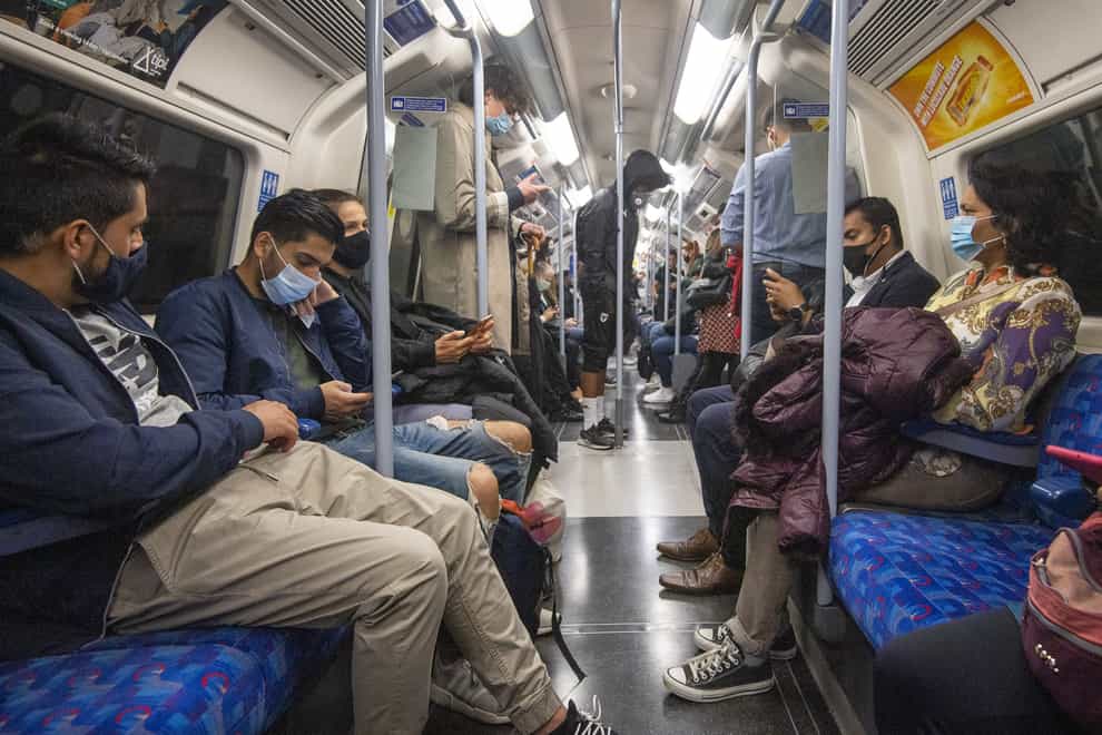 Tube workers have voiced concern about a fall in the number of passengers wearing face masks (Yui Mok/PA)
