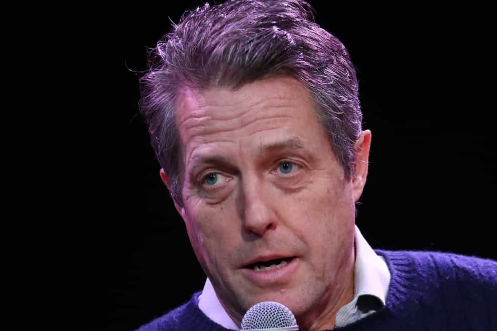 Hugh Grant has donated a further £5,000 to a charity which provides free plumbing and heating work for the elderly (PA)