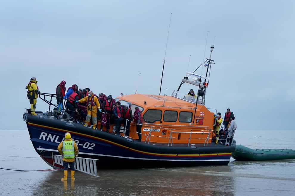 A group of people thought to be migrants are brought in to Dungeness, Kent, by the RNLI following a small boat incident in the Channel (Gareth Fuller/PA)