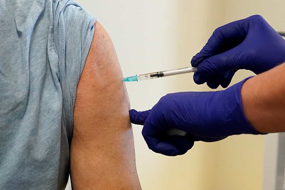 A patient receiving a Covid-19 vaccine booster (Martin Rickett/PA)