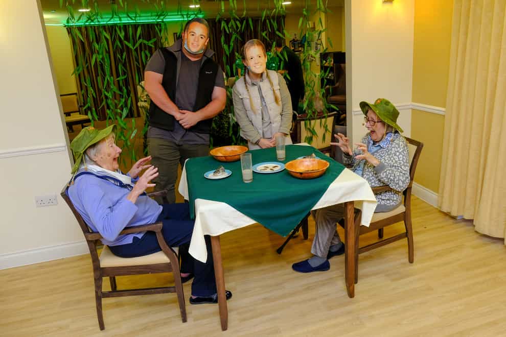 Residents Doreen Barber, 96, and Mary Tierney, 92, take part in a bushtucker trial at Care UK’s Mountfitchet House care home (Care UK/PA)
