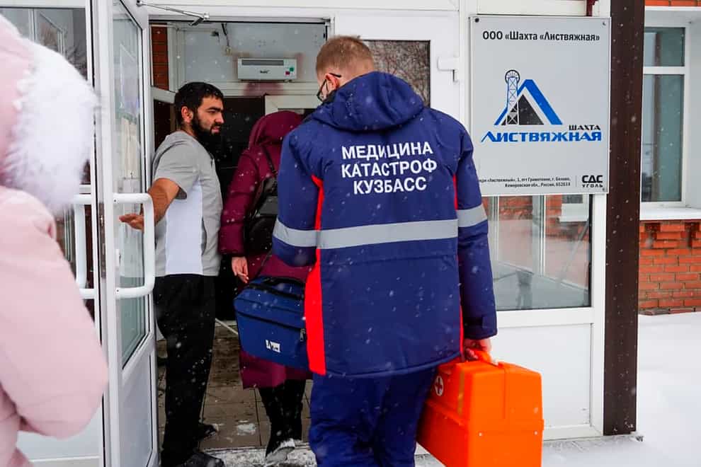 Rescuers enter a checkpoint of the Listvyazhnaya coal mine out of the Siberian city of Kemerovo, about 3,000 kilometres (1,900 miles) east of Moscow, Russia, Thursday, Nov. 25, 2021. A fire at a coal mine in Russia’s Siberia killed 11 people and injured more than 40 others on Thursday, with dozens of others still trapped, authorities said. (Governor of Kemerovo region press office photo via AP)