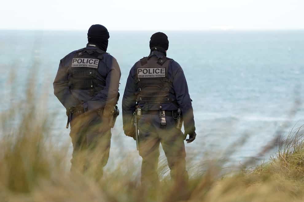French police officers patrol the beaches in Wimereux near Calais (Gareth Fuller/PA)
